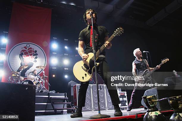 Tre Cool, Billie Joe Armstrong, and Mike Dirnt of Green Day perform at the Brighton Centre on February 5, 2005 in Brighton, England.