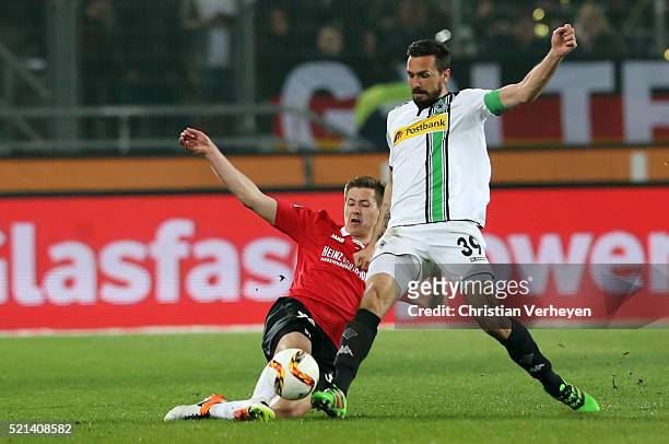 Miiko Albornoz of Hannover 96 and Martin Stranzl of Borussia Moenchengladbach battle for the ball during the Bundesliga match between Hannover 96 and...