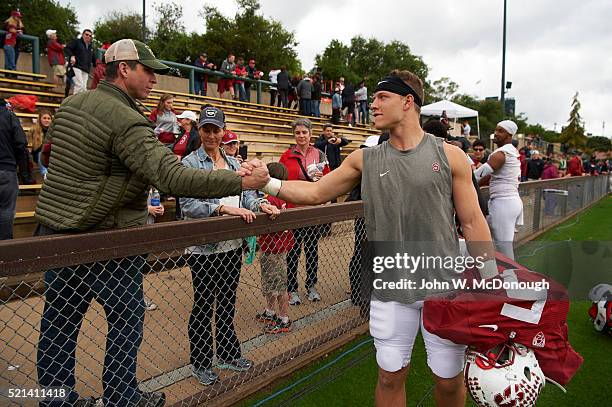 Stanford Christian McCaffrey shaking hands with his father Ed and his mother Lisa looking on after spring game at Cagan Stadium. Palo Alto, CA...