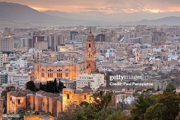 malaga cathedral and the city at dusk, andalucia, spain - malaga fotografías e imágenes de stock