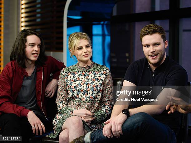 Ferdia Walsh-Peelo, Lucy Boynton and Jack Reynor visit "Extra" at Universal Studios Hollywood on April 15, 2016 in Universal City, California.