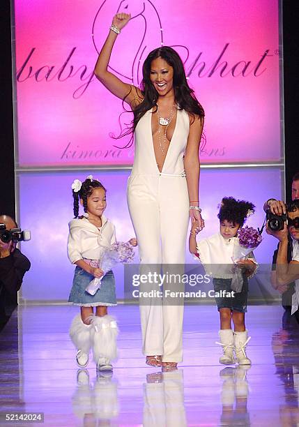 Baby Phat designer Kimora Lee Simmons and her daughters walks the runway during her Baby Phat Fall 2005 show during Olympus Fashion Week at Skylight...