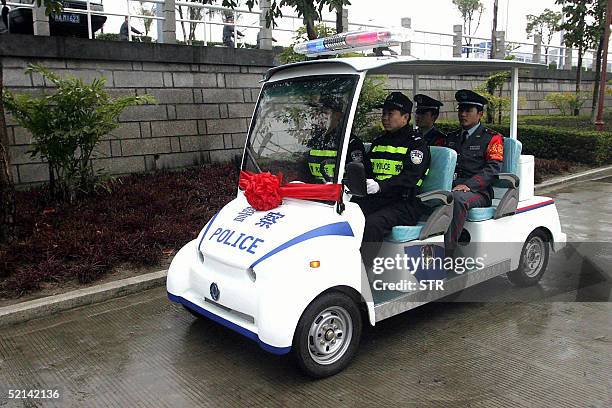 Police and security guards patrol a newly opened theme park for the Chinese Lunar New Year holidays in Fuzhou, southeast China's Fujian province 05...