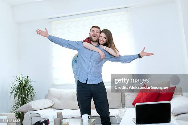 young embraced couple welcoming in their new home - next to stock pictures, royalty-free photos & images