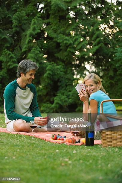 couple having a picnic in the park - full house stock pictures, royalty-free photos & images