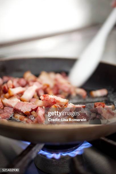 chunks of bacon cooking in pan on a gas stove - carbonara stock pictures, royalty-free photos & images