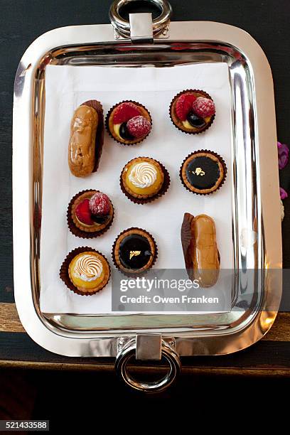 a tray of petit fours, french pastries - プチフール ストックフォトと画像