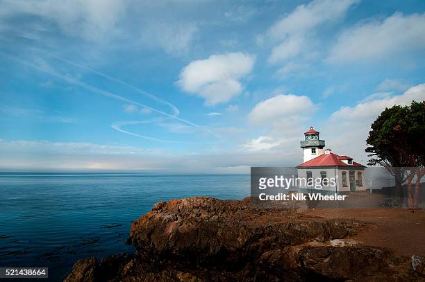 Lighthouse at Lime Kiln Point State Park stands on a promontory overlooking the Pacific Ocean on the west coast of San Juan Island off Washington...