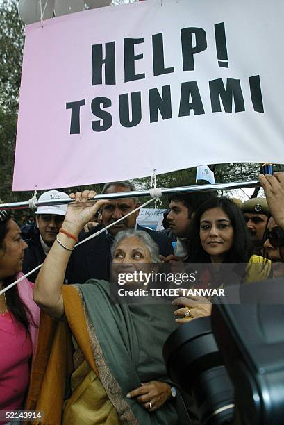 New Delhi Chief Minister Sheila Dixit takes part in the "Light for Life" walk aimed at raising funds for the victims of the December 26 tsunamis, in...