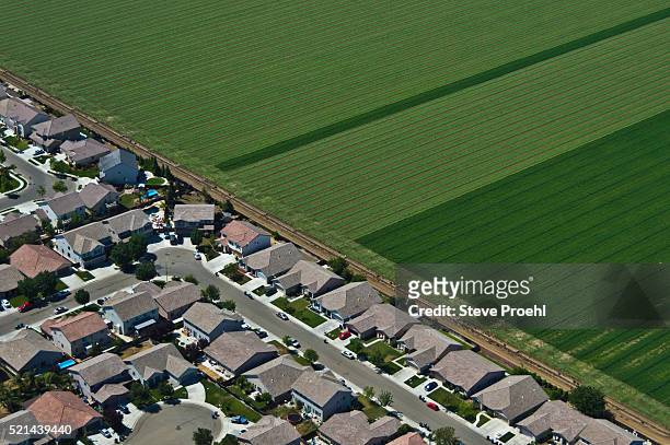 suburbs and farmland - rural housing stock pictures, royalty-free photos & images