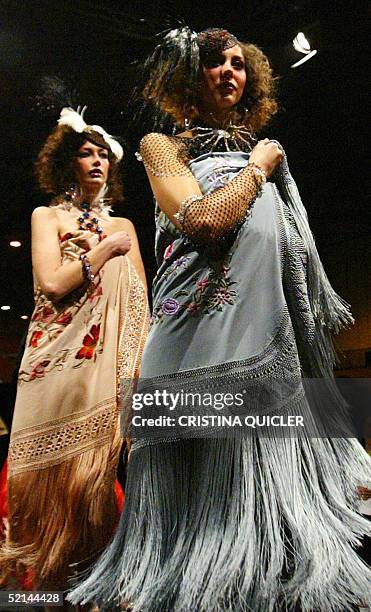 Models wears a creation with shawls by Spanish designer Manos Bordadoras during the Simof 'Salon International of Flamenco Fashion' show at the...