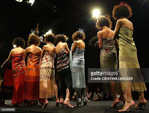 Models wears a creation with shawls by Spanish designer Manos Bordadoras during the Simof 'Salon International of Flamenco Fashion' show at the...
