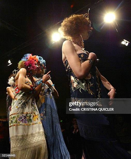 Models wears a creation with shawls by Spanish designer Manos Bordadoras during the Simof 'Salon International of Flamenco Fashion' show at the...