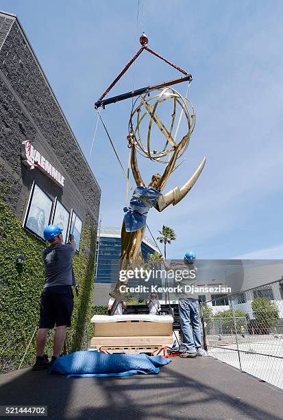 The 18-foot 1,750 pound golden Emmy statuette is installed at Television Academy's North Hollywood Campus April 15, 2016 in North Hollywood,...