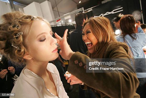 Model Sinya and makeup artist Melly Rontal is seen backstage during the Tracy Reese Fall 2005 fashion show during Olympus Fashion Week at Bryant Park...
