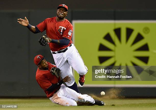 Eduardo Nunez and Miguel Sano of the Minnesota Twins collide in right field going after a ball hit by Yunel Escobar of the Los Angeles Angels of...