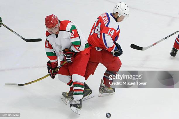 Gustavo Martinez of Mexico fights for the puck with Hyok Kim Nam of Korea during the match between Mexico and Korea as part of the 2016 IIHF Ice...