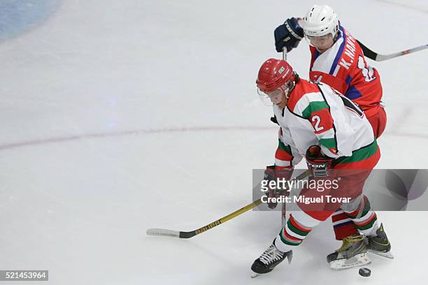 Gustavo Martinez of Mexico fights for the puck with Hyok Kim Nam of Korea during the match between Mexico and Korea as part of the 2016 IIHF Ice...