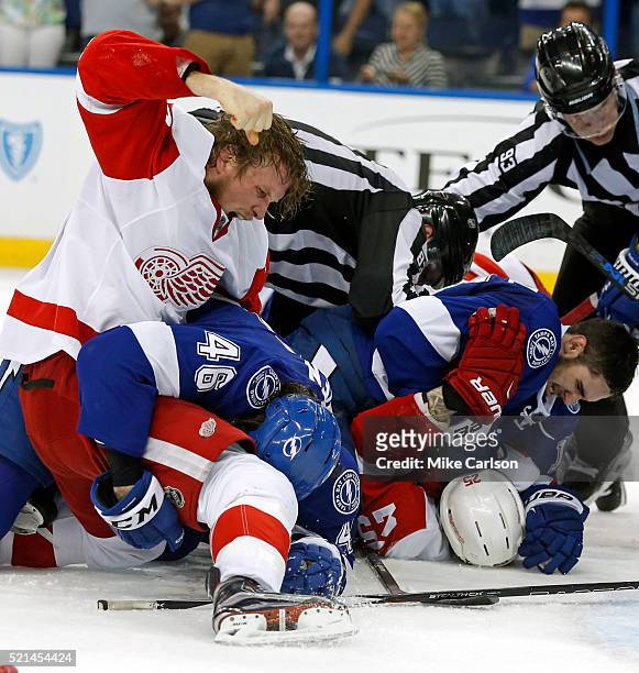 Justin Abdelkader of the Detroit Red Wings punches Michael Blunden of the Tampa Bay Lightning during the third period in Game Two of the Eastern...