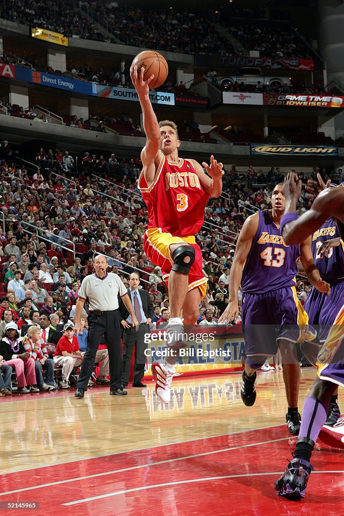 Brian Reeves Houston Rockets Bob Sura of the Houston Rockets shoots in front of Brian Cook of the ...
