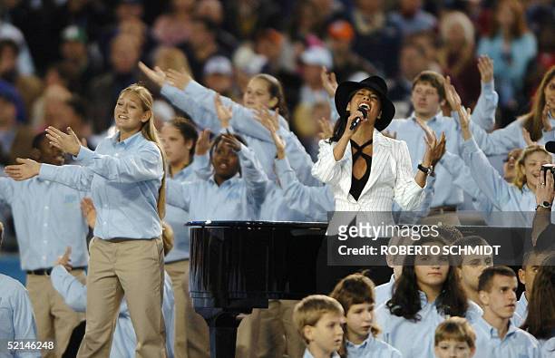 Alicia Keys is accompanied by students from the Florida School for the Deaf and Blind as she sings "America The Beautiful" during the Super Bowl...