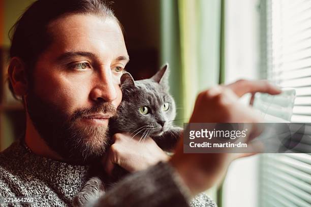 man and cat taking selfie - chartreux cat stockfoto's en -beelden