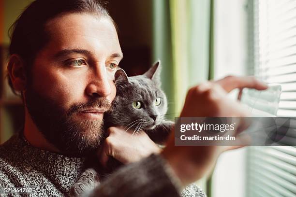 man and cat taking selfie - cat selfie stock pictures, royalty-free photos & images