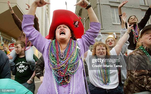 Revelers scream for beads at a parade during Mardi Gras festivites February 6, 2005 in New Orleans, Louisiana. Festivities will continue all weekend,...