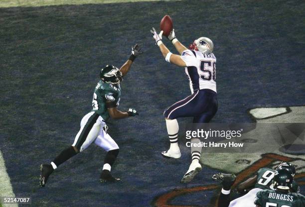 Linebacker Mike Vrabel of the New England Patriots catches a two yard touchdown in the third quarter against cornerback Lito Sheppard of the...