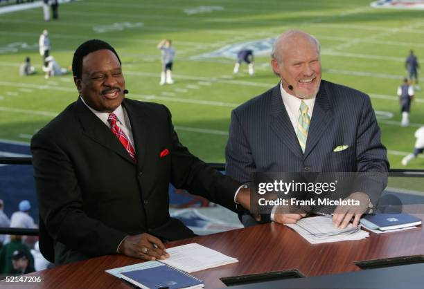 Sportscasters James Brown and Terry Bradshaw speak in the FOX Broadcast booth during the XXXIX Superbowl pregame show at Alltel Stadium on February...