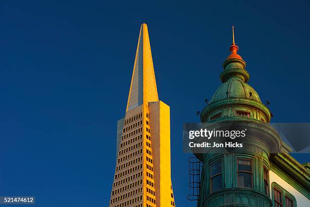 detail of the zoetrope building and transamerica pyramid. - san francisco financial district stock pictures, royalty-free photos & images