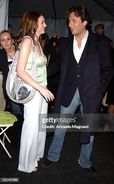 Anne Hathaway and Raphaello Foglieri attend the Luca Luca Fall 2005 during Olympus Fashion week at Bryant Park February 6, 2005 in New York City.