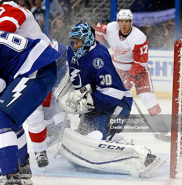Ben Bishop of the Tampa Bay Lightning makes a save against the Detroit Red Wings during the third period in Game Two of the Eastern Conference...
