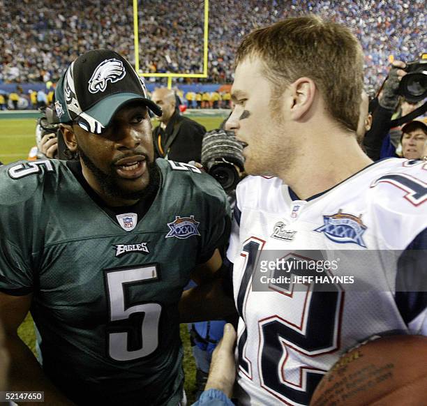 Quarterback Donovan McNabb of the Philadelphia Eagles and his New England Patriots counterpart Tom Brady talk 06 February, 2005 after Brady and the...