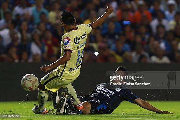 Angel Sepulveda of Queretaro struggles for the ball with Osvaldo Martinez of America during the 14th round match between Queretaro and America as...