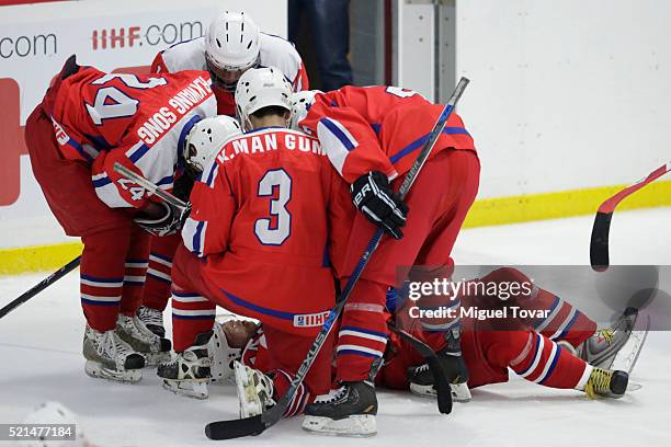 Nam Hyok Kim of Korea grimaces in pain after been fouled during the match between Mexico and Korea as part of the 2016 IIHF Ice Hockey World...