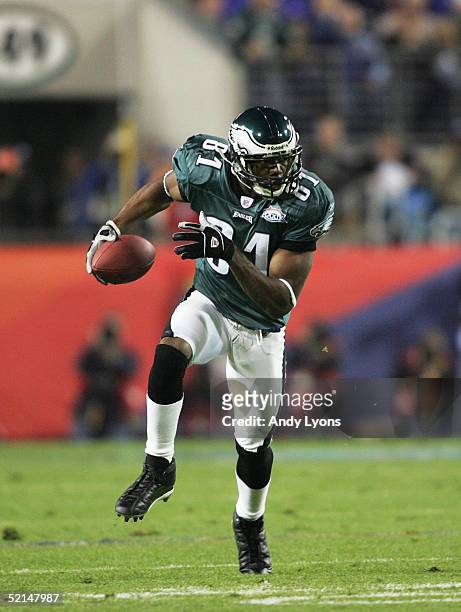 Terrell Owens of the Philadelphia Eagles carries the ball against the New England Patriots in Super Bowl XXXIX at Alltel Stadium on February 6, 2005...