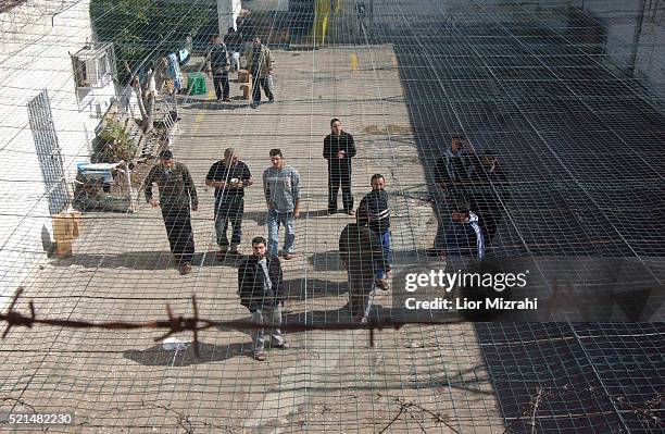 Palestinian prisoners, convicted of security offenses against Israel, are seen at the courtyard in Megido jail, northern Israel February 15, 2005....