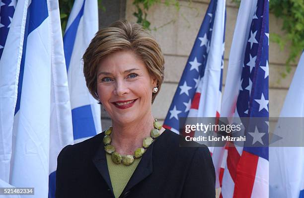 First lady Laura Bush smiles after being greeted by Gila Katzav, the wife of Israeli President Moshe Katzav, at the president house in Jerusalem...