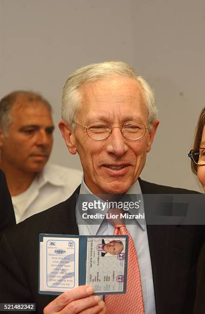 Former first deputy managing director of the International Monetary Fund , Stanley Fischer holding his newly acquired Israeli ID at the Interior...