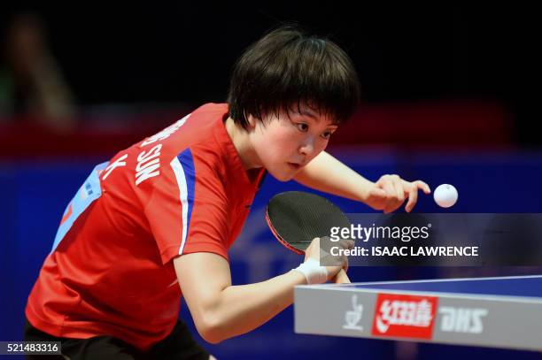 North Korean Ri Myong Sun eyes the ball during stage two of the women's singles final match against Das Mouma of India at the Asian Table Tennis...