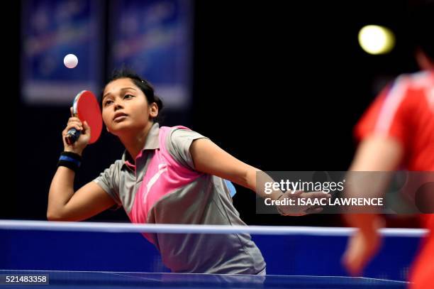 Das Mouma of India returns the ball during stage two of the women's singles final match against North Korear Ri Myong Sun at the Asian Table Tennis...