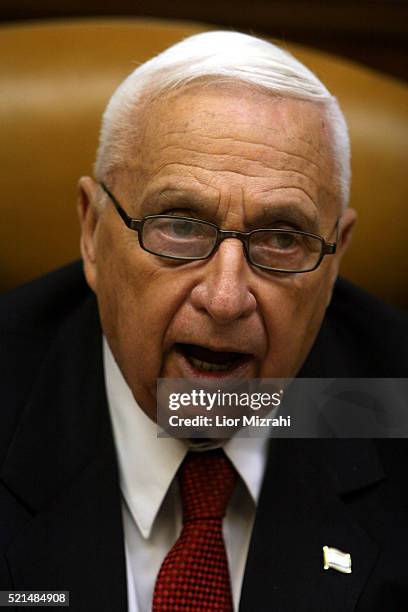 Israeli Prime Minister Ariel Sharon speaks at the beginning of the weekly cabinet meeting at his Jerusalem office Sunday, January 01, 2006.