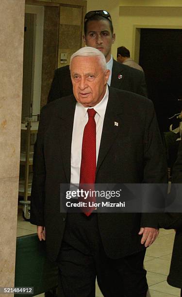 Israeli Prime Minister Ariel Sharon arrives to the weekly cabinet meeting at his Jerusalem office Sunday, January 01, 2006.