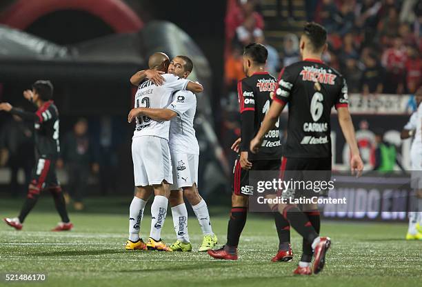 Carlos Sanchez and Walter Gargano embrace as they celebrate their team's victory after the 14th round match between Monterrey and Tijuana as part of...