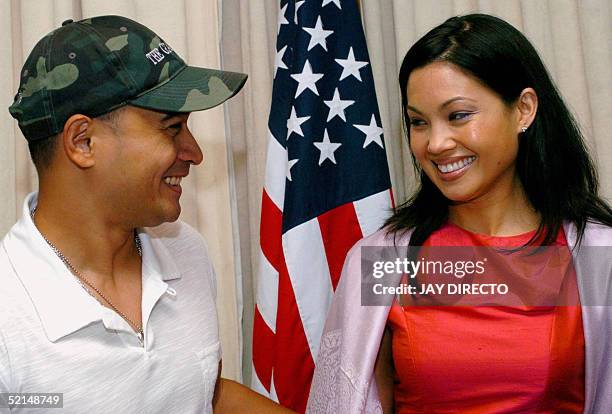 Filipino actor Cesar Montano and Filipina-Australian actress Natalie Mendoza smile as they pose in Manila, 07 February 2005 during a press conference...