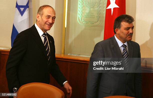 Turkish Foreign Minister Abdullah Gul and Israeli Prime Minister Ehud Olmert after their meeting in Jerusalem on Sunday Aug. 20 2006.