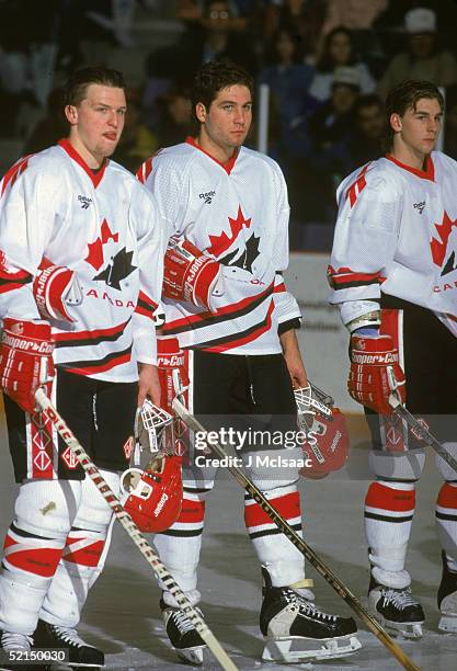 Three members of Team Canada stand on the ice at the World Junior Championships, Alberta, Canada, 1995. From left, Bryan McCabe, Ed Jovanovski, and...