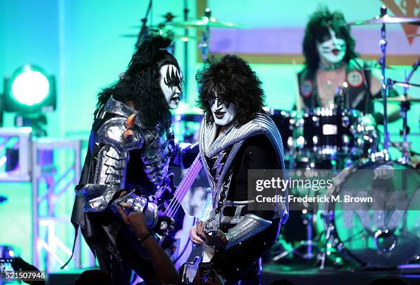 Musicians Gene Simmons, Tommy Thayer and Eric Singer of Kiss perform onstage during the 23rd Annual Race To Erase MS Gala at The Beverly Hilton Hotel...