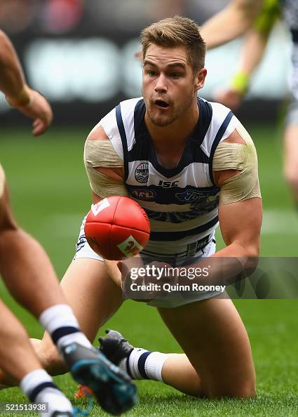 Tom Rugg Australia Tom Ruggles of the Cats handballs during the round four AFL match ...